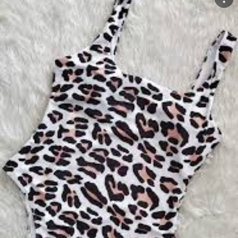 Animal print one piece high cut bodysuit in medium